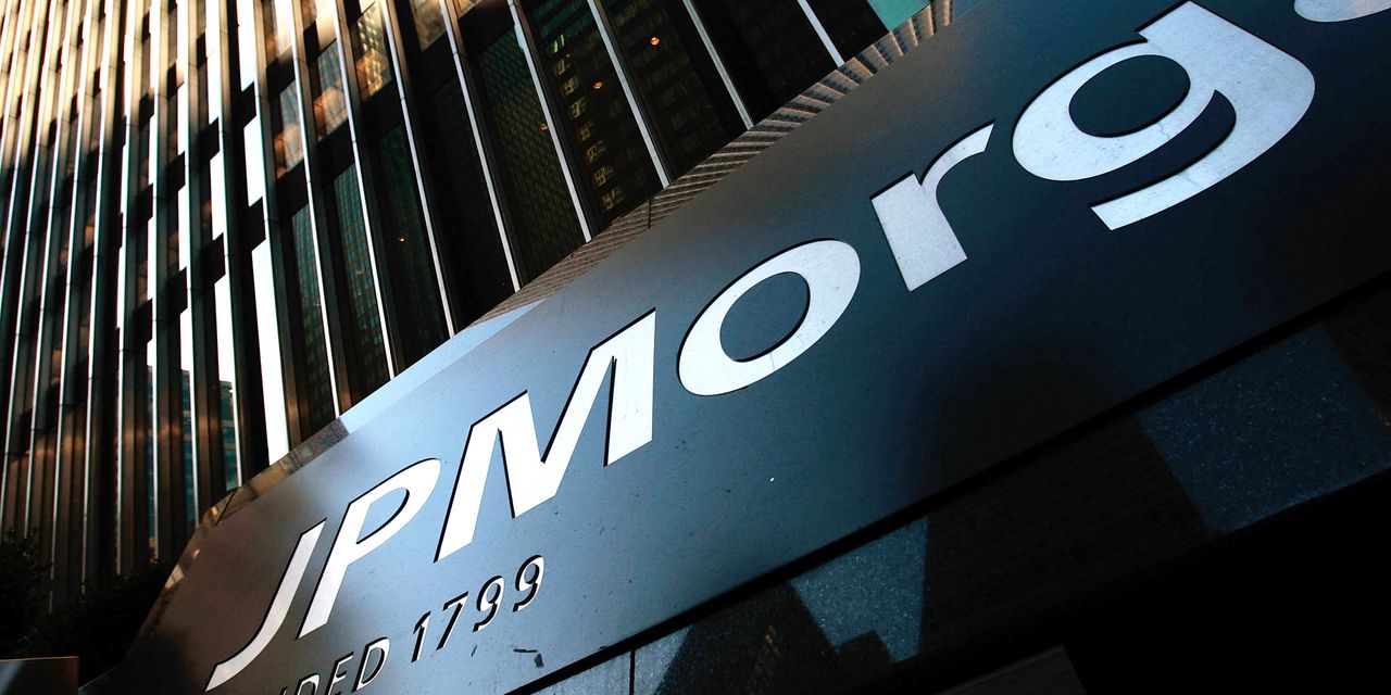 JPMorgan shares slide after earnings miss estimates and bank pauses share buybacks