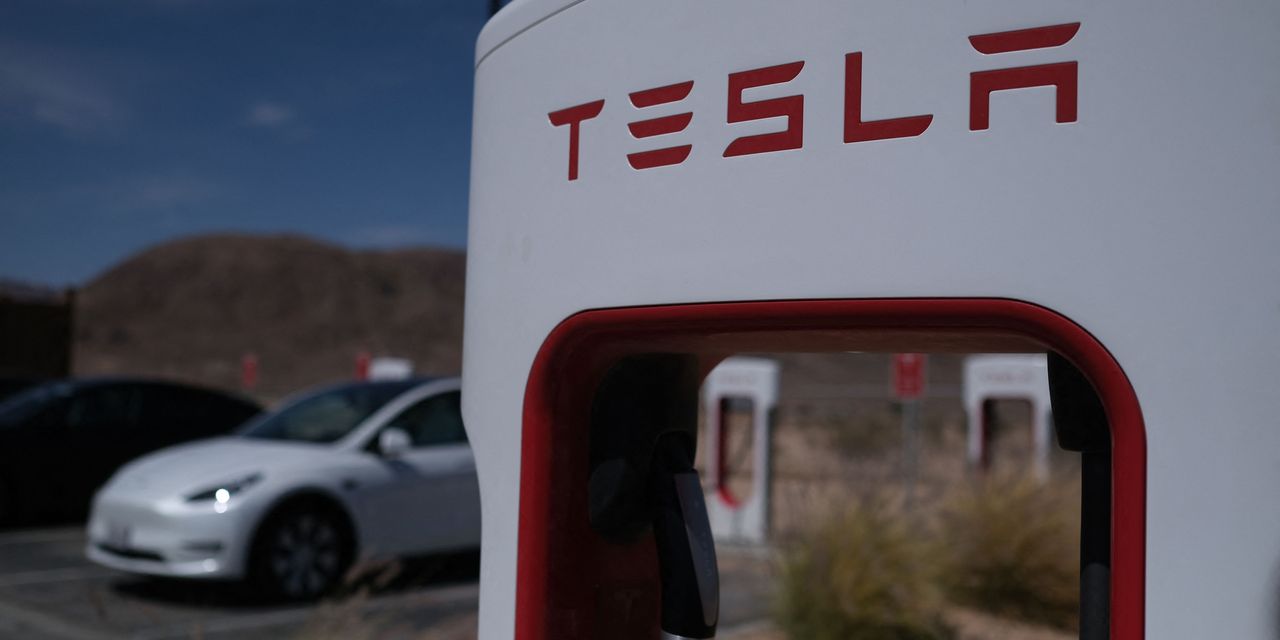 Tesla analysts trim their estimates after deliveries fall