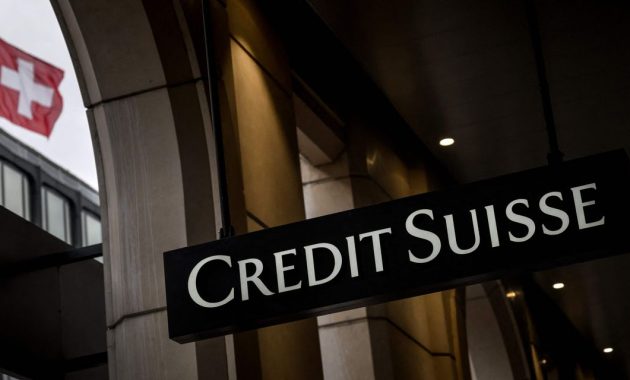 Credit Suisse shares dive toward record low after credit downgrades