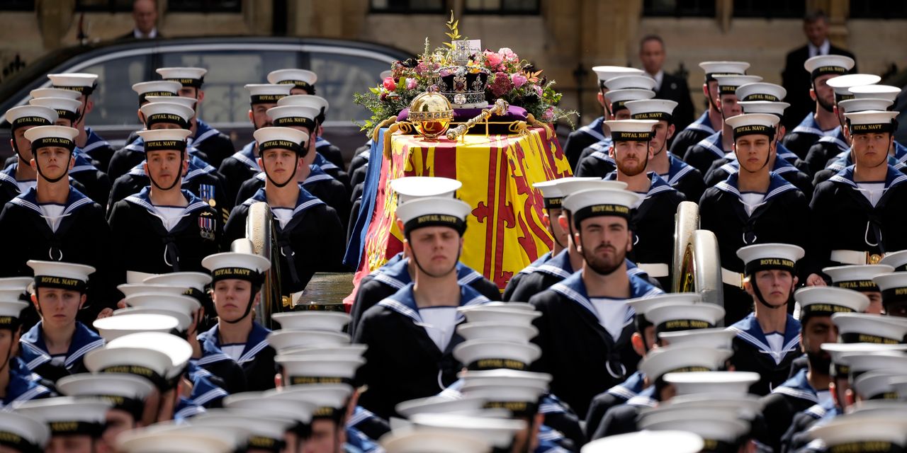 Queen's coffin being taken through London on gun carriage